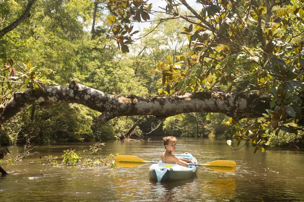 Teenage boy in kayak in Florida, USA | Timbers Jupiter Private Residence Club Real Estate